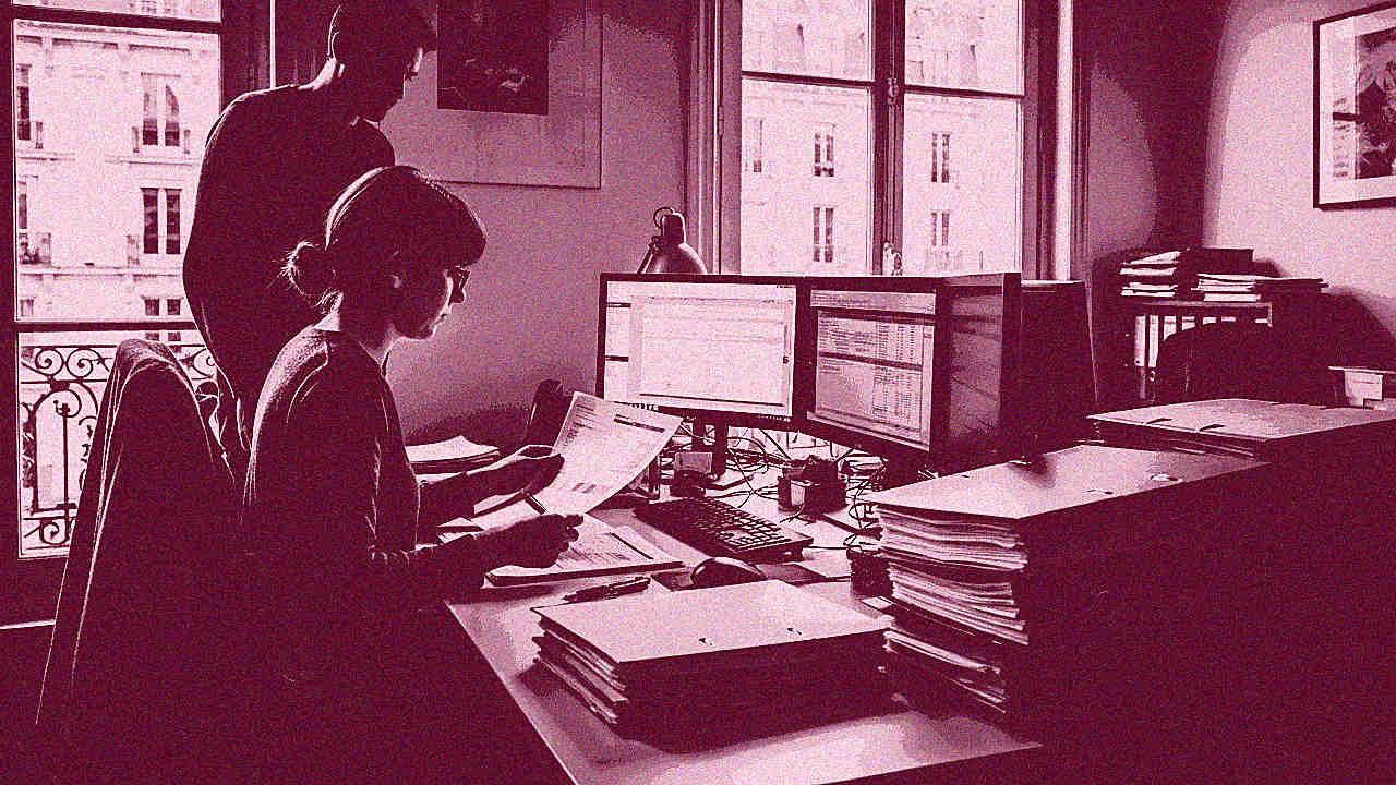 Net Zero vs Carbon Neutral: production team reviewing climate strategy reports in a Paris office